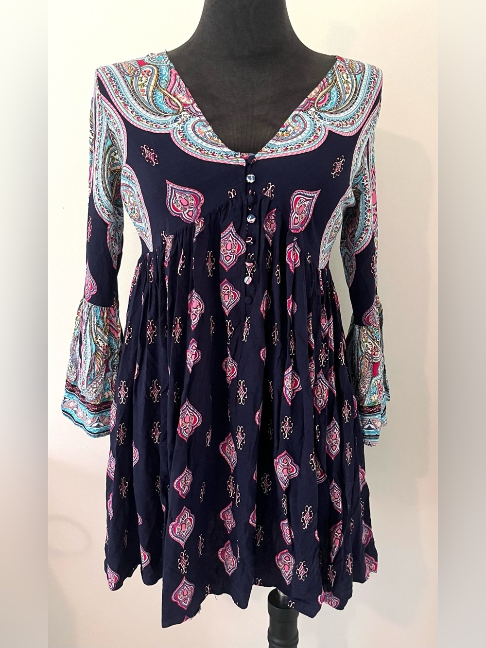 Bohemian-style Umgee bell sleeve tunic top/dress featuring a deep navy base